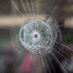 gun violence - bullet hole in a window